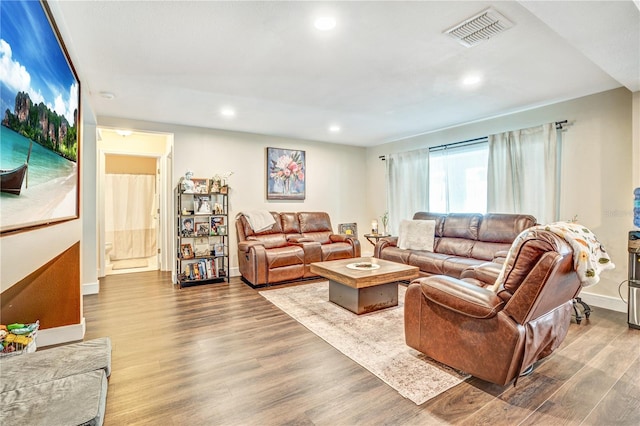 16755 Sunrise Vista Dr, Clermont, FL 34714 - living area featuring baseboards, visible vents, wood finished floors, and recessed lighting