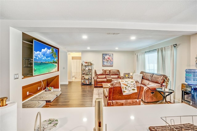 16755 Sunrise Vista Dr, Clermont, FL 34714 - living area featuring recessed lighting, a textured ceiling, visible vents, and wood finished floors