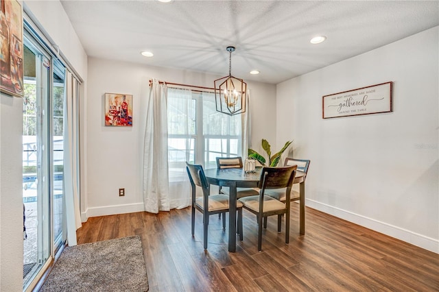 16755 Sunrise Vista Dr, Clermont, FL 34714 - dining space with baseboards, dark wood-style floors, recessed lighting, and a notable chandelier