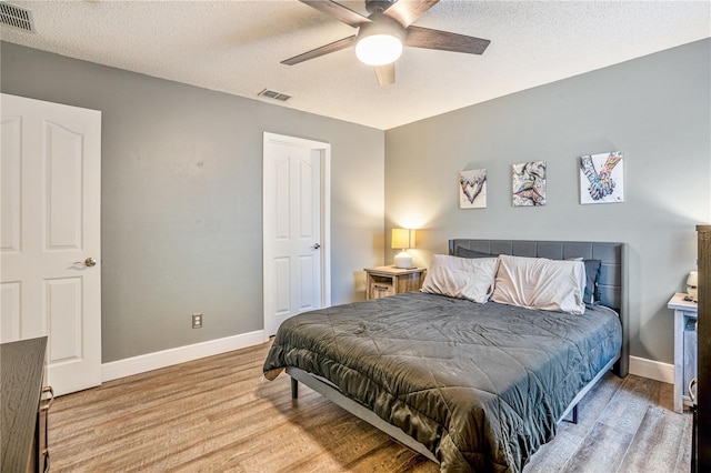 16755 Sunrise Vista Dr, Clermont, FL 34714 - bedroom featuring baseboards, visible vents, and wood finished floors