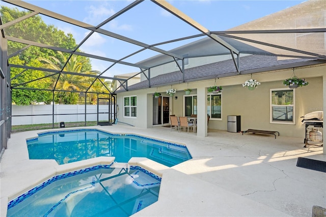 16755 Sunrise Vista Dr, Clermont, FL 34714 - view of pool with fence, a pool with connected hot tub, a lanai, and a patio area