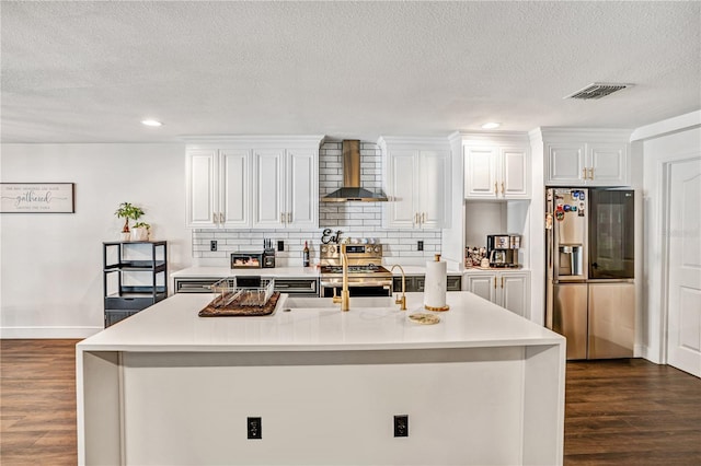 16755 Sunrise Vista Dr, Clermont, FL 34714 - kitchen with a sink, dark wood-style floors, visible vents, appliances with stainless steel finishes, and wall chimney exhaust hood