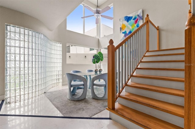 4522 W N B St, Tampa, FL 33609 - staircase featuring ceiling fan and a towering ceiling