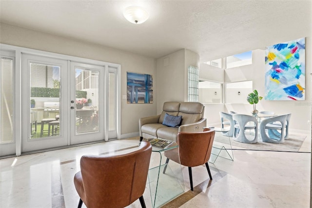 4522 W N B St, Tampa, FL 33609 - living area with baseboards, french doors, and a textured ceiling