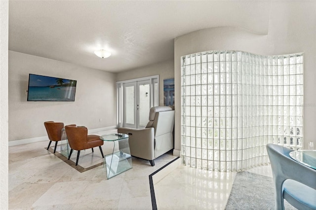 4522 W N B St, Tampa, FL 33609 - living area featuring baseboards and french doors