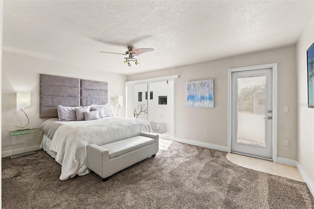 4522 W N B St, Tampa, FL 33609 - carpeted bedroom with baseboards, a ceiling fan, and a textured ceiling