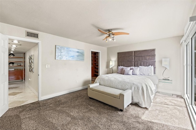 4522 W N B St, Tampa, FL 33609 - carpeted bedroom featuring a spacious closet, a baseboard radiator, baseboards, visible vents, and ceiling fan