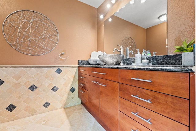 4522 W N B St, Tampa, FL 33609 - full bathroom with tile walls, a textured wall, and vanity