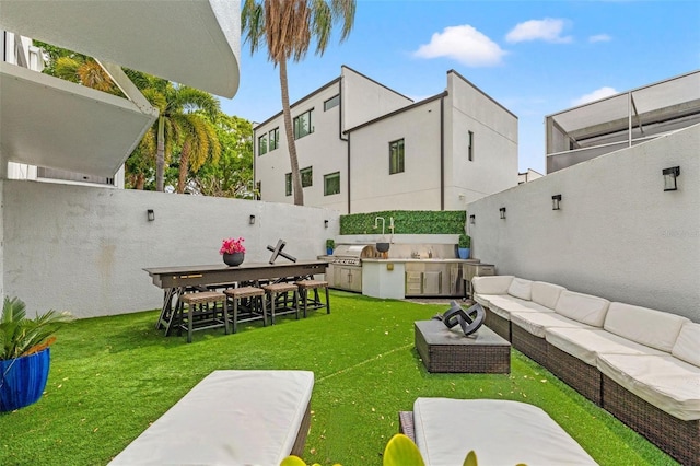 4522 W N B St, Tampa, FL 33609 - view of yard featuring an outdoor hangout area, exterior kitchen, and a fenced backyard