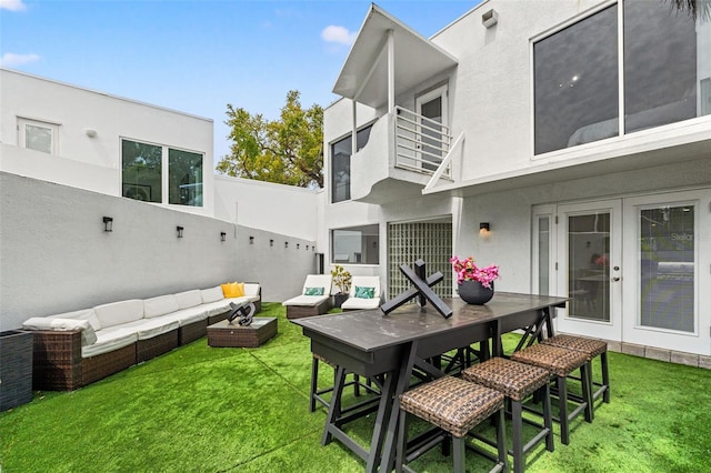 4522 W N B St, Tampa, FL 33609 - exterior space featuring a balcony, outdoor dining space, and an outdoor hangout area