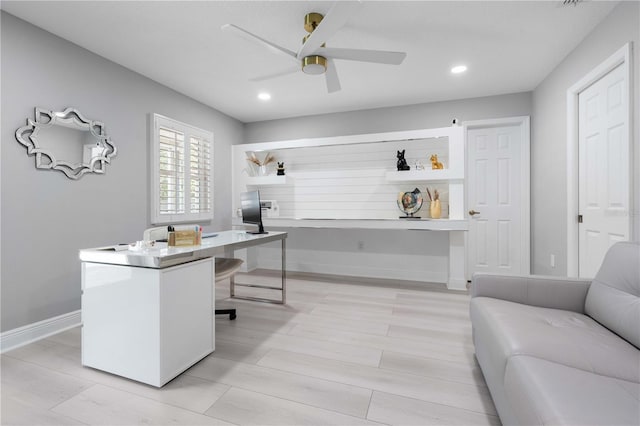 office space featuring a ceiling fan, baseboards, and recessed lighting