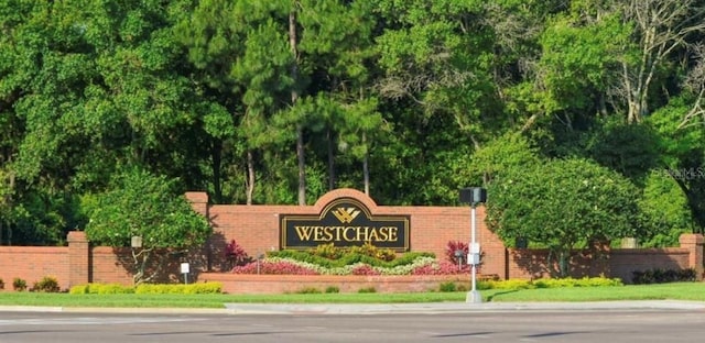 community sign with fence