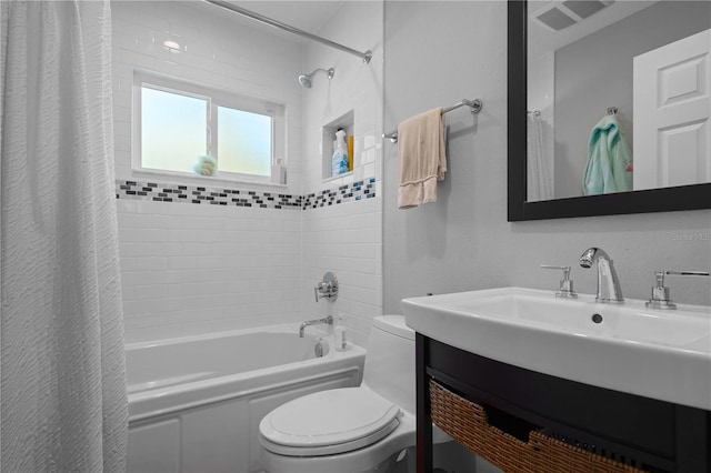 bathroom with vanity, toilet, visible vents, and shower / tub combo with curtain