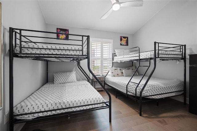 bedroom featuring wood finished floors, ceiling fan, and lofted ceiling