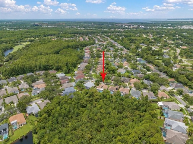 bird's eye view with a water view, a residential view, and a forest view