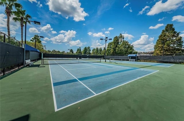 view of sport court with fence