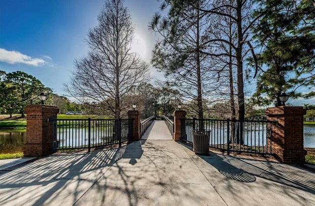view of gate with a water view