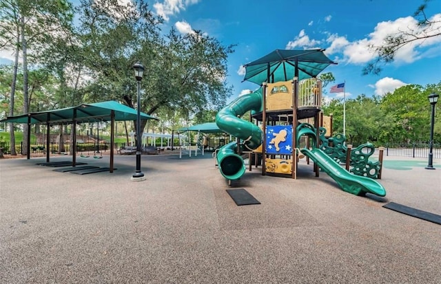 communal playground featuring fence