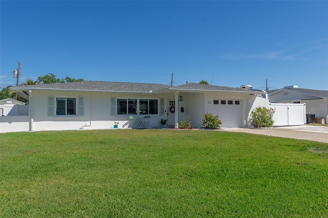 single story home with stucco siding, a garage, and fence