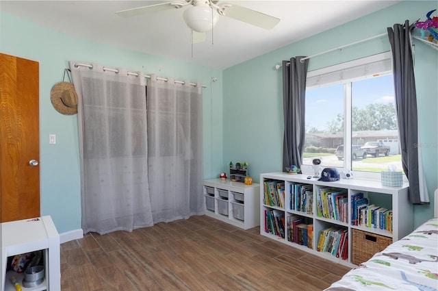 bedroom with wood finished floors and a ceiling fan