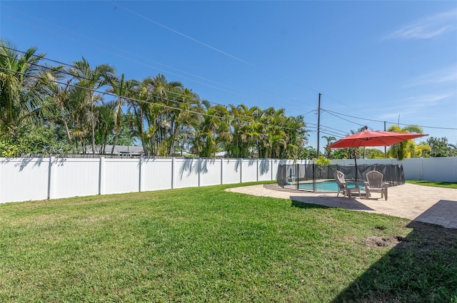 view of yard with a fenced in pool, a fenced backyard, and a patio area