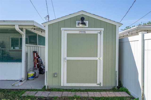view of shed with fence