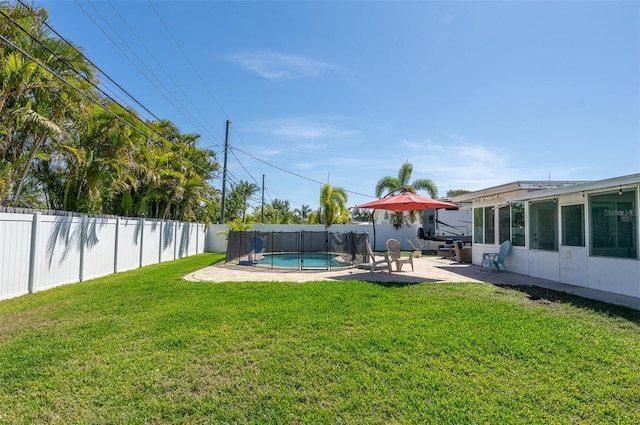 view of yard featuring a fenced backyard, a patio, and a fenced in pool