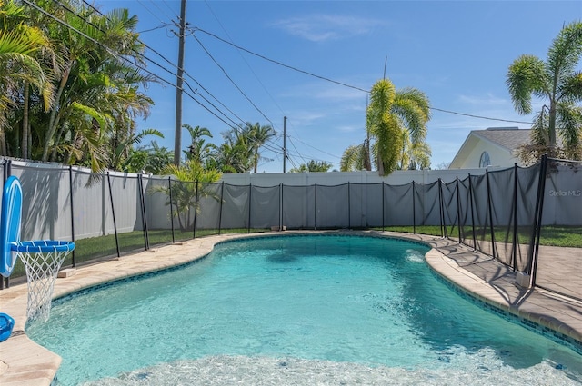 view of pool featuring a fenced backyard, a fenced in pool, and a patio area