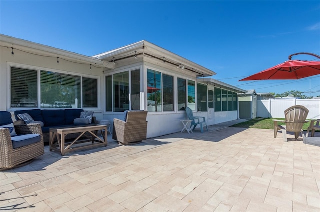 view of patio / terrace with an outdoor living space and fence