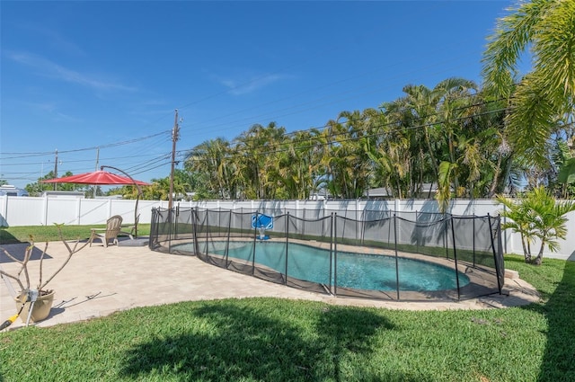 view of pool with a fenced backyard, a fenced in pool, a patio area, and a yard