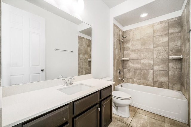 full bathroom with tile patterned floors, bathing tub / shower combination, vanity, and toilet