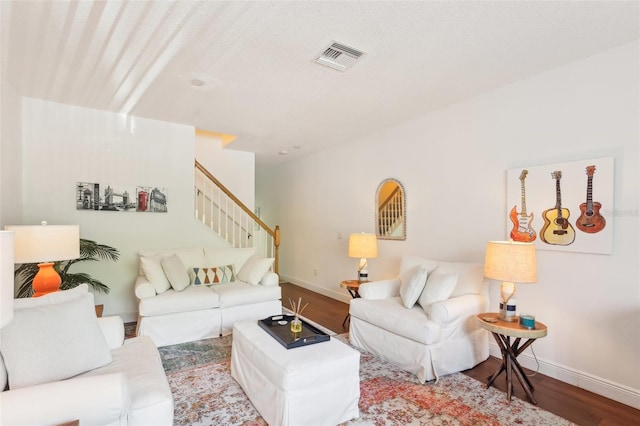 18187 Paradise Point Dr, Tampa, FL 33647 - living room with wood finished floors, stairway, and baseboards