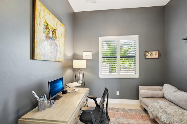office area featuring baseboards