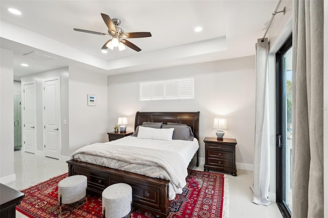 bedroom with a ceiling fan, a tray ceiling, baseboards, and recessed lighting