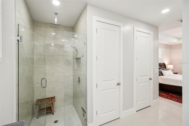 bathroom featuring a stall shower, connected bathroom, and recessed lighting