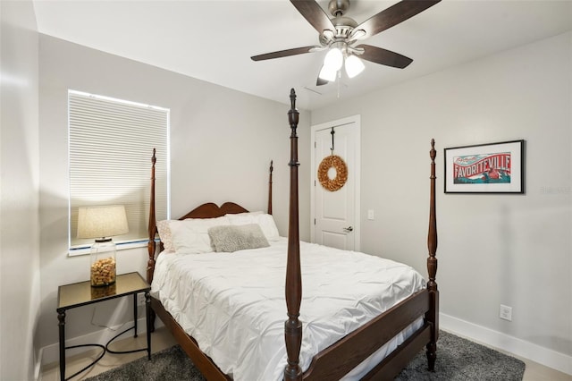 bedroom featuring baseboards and a ceiling fan