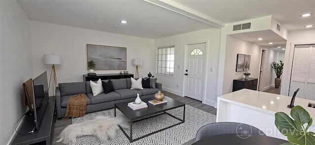 living room with baseboards, visible vents, recessed lighting, and dark wood-style flooring