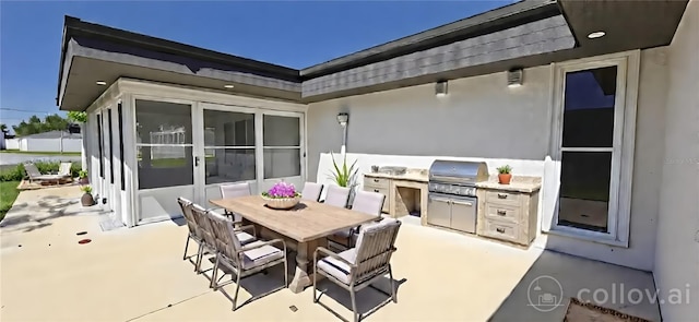 view of patio with a sunroom, grilling area, outdoor dining area, and an outdoor kitchen