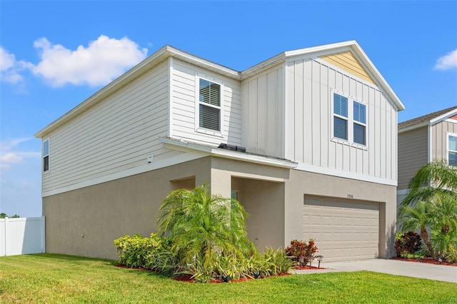 12856 French Market Dr, Riverview, FL 33579 - view of front facade with stucco siding, an attached garage, board and batten siding, driveway, and a front lawn