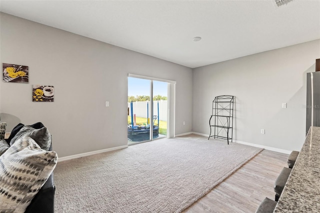 12856 French Market Dr, Riverview, FL 33579 - interior space featuring baseboards, wood finished floors, and carpet floors
