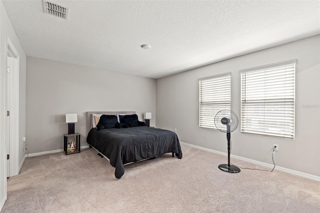 12856 French Market Dr, Riverview, FL 33579 - bedroom featuring light carpet, baseboards, and visible vents