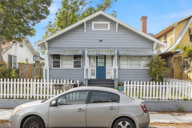 1134 9th Ave S, Saint Petersburg, FL 33705 - bungalow-style house featuring a fenced front yard