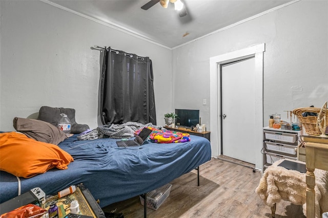 1134 9th Ave S, Saint Petersburg, FL 33705 - bedroom featuring crown molding, wood finished floors, and a ceiling fan