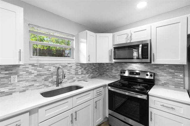 1134 9th Ave S, Saint Petersburg, FL 33705 - kitchen with light countertops, a sink, and stainless steel appliances