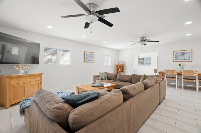 living area featuring recessed lighting, a ceiling fan, and a wealth of natural light