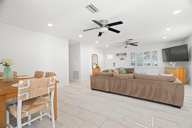 living room featuring ceiling fan, baseboards, visible vents, and recessed lighting