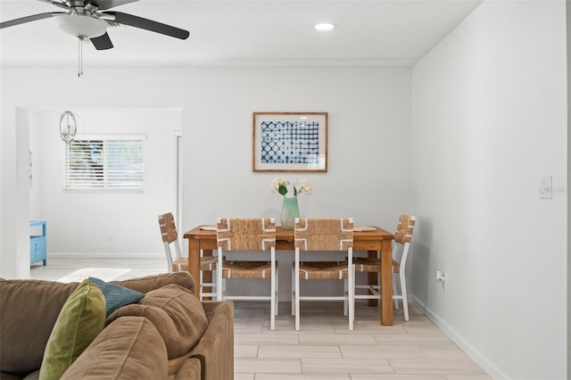 dining room with light wood-style flooring, ceiling fan, recessed lighting, and baseboards