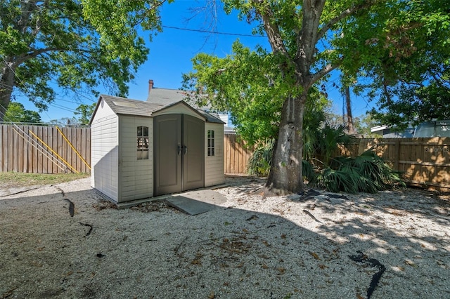 view of shed featuring a fenced backyard