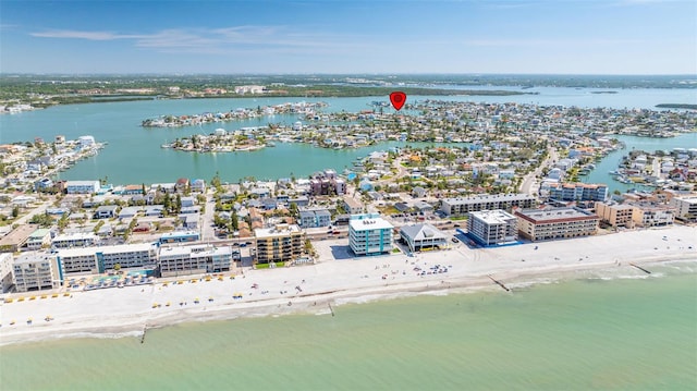 aerial view with a water view and a beach view