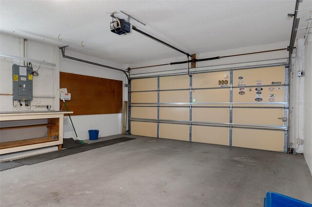 garage featuring electric panel and a garage door opener